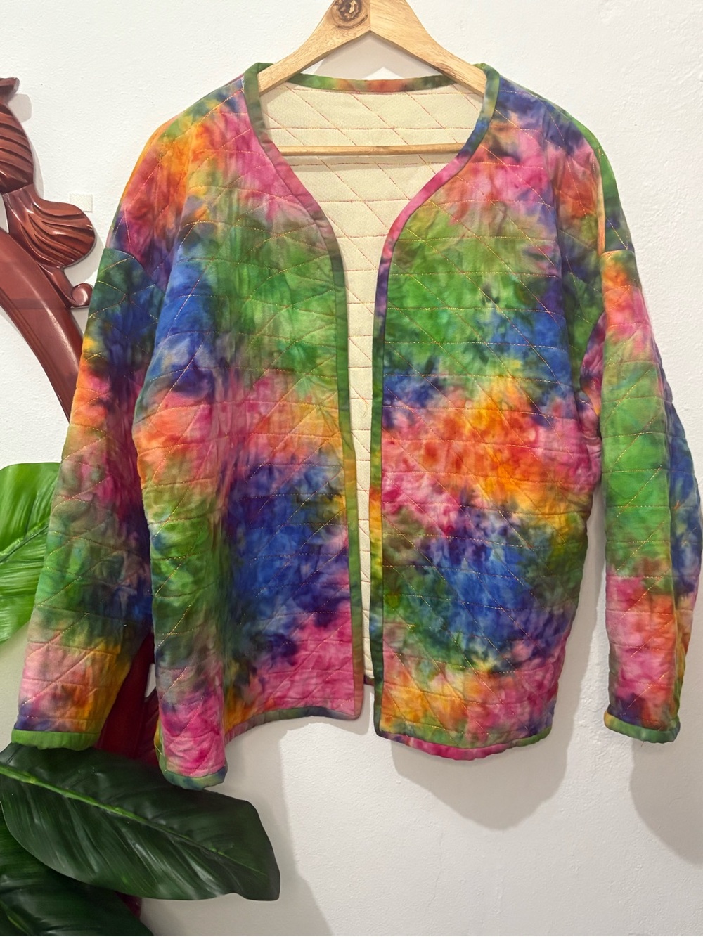 Women’s handmade boho vibrant tie dye quilted jacket with rainbow stitching